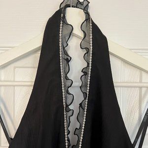 Black cocktail dress with zirconia & ruffle embellishment along the neckline